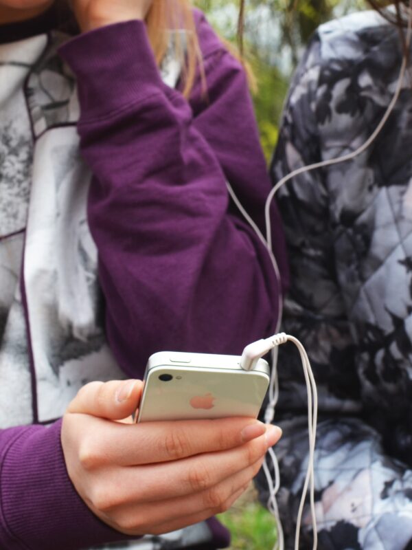 Teens holding cellphone privacy