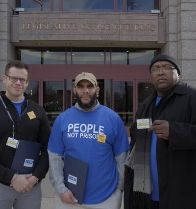 ACLU Connecticut Smart Justice leaders Gus, Anderson, Ramon at the CT state capitol building / legislative office building