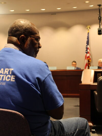 ACLU-CT Smart Justice leaders sit in the audience as the Criminal Justice Commission hears testimony about the Chief State's Attorney search.