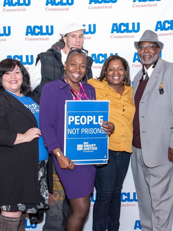 ACLU-CT Smart Justice leaders and Rep. Robyn Porter stand in front of an ACLU of Connecticut banner at the "Smart Justice: Year One" film premiere in New Haven