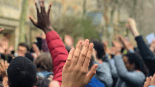 ACLU of Connecticut 2019 Annual Report cover shows, from behind, a crowd of people in "hands up, don't shoot" position. "2019 annual report" appears at the top, with the ACLU of Connecticut logo in white at the bottom
