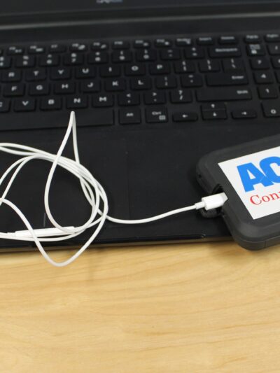 ACLU of Connecticut photo of laptop, phone, headphones with an ACLU of Connecticut sticker