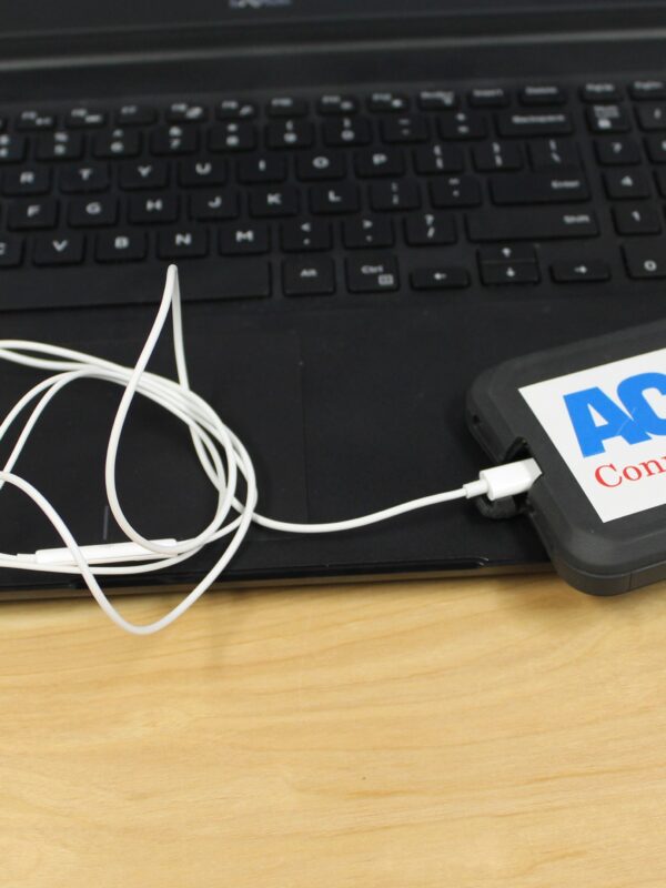 ACLU of Connecticut photo of laptop, phone, headphones with an ACLU of Connecticut sticker