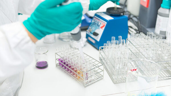 beakers and lab technician hands