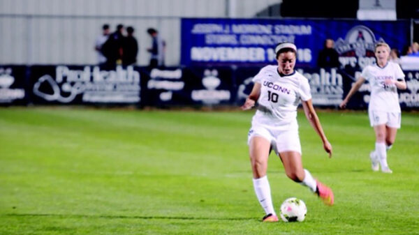 UCONN Soccer player and author Noriana Radwan is seen on the soccer pitch.