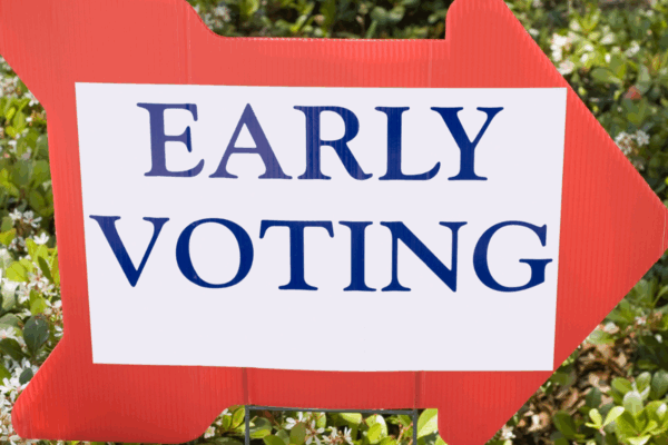 Red arrow right facing right that says early voting in blue font with a white background