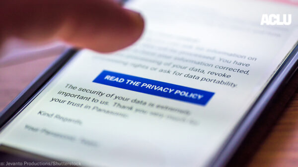 On an iphone screen, a finger can be seen tapped the "Read the Privacy Policy" button among blurred text.