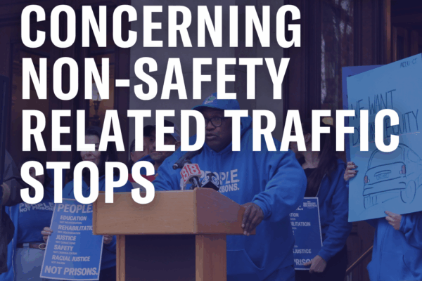 On a faded photo of Anderson speaking in front of the Capitol, the following text appears in white: "H.B. 7132: An Act Concerning Non-Safety Related Traffic Stops."
