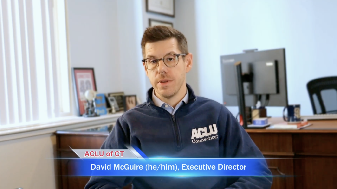 David McGuire, executive director, is sitting in front of the camera.