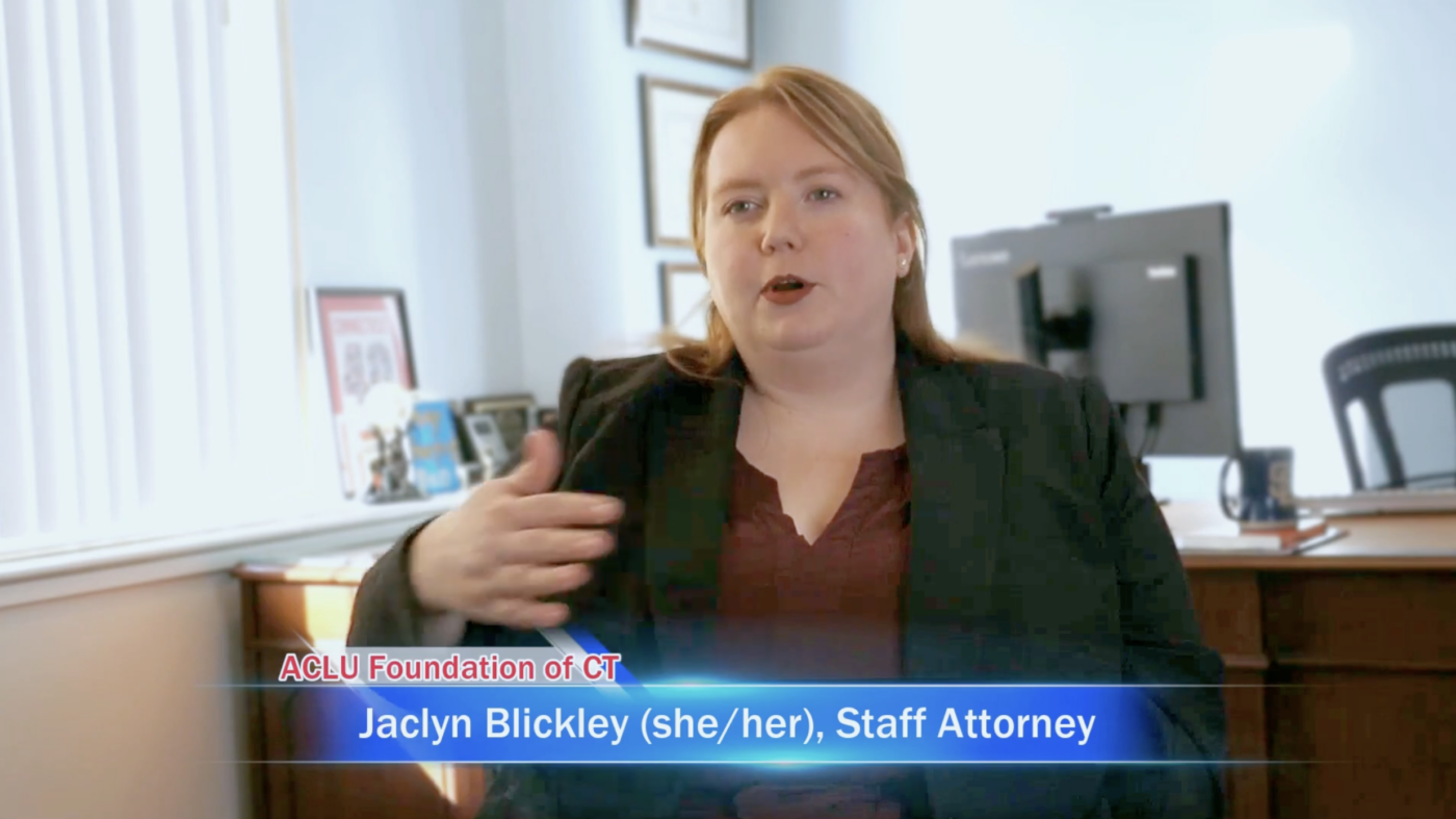 Jaclyn Blickley, our staff attorney, sits in front of the camera.