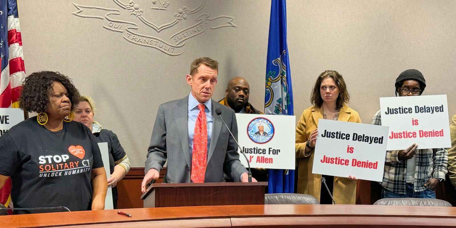 Dan, legal director, is with Grace, senior paralegal, and other partners at a press conference for Stop Solitary CT.