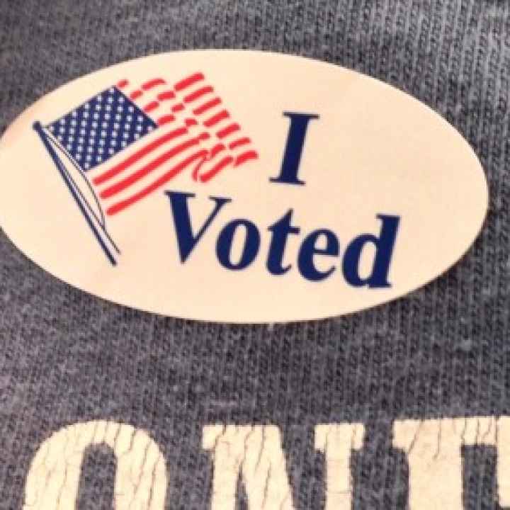 Sticker saying "I voted" with American flag