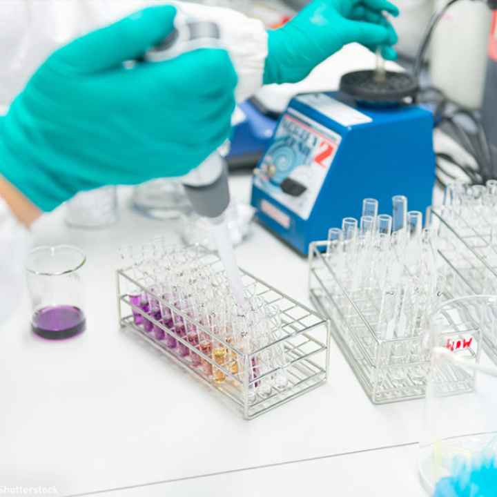 beakers and lab technician hands