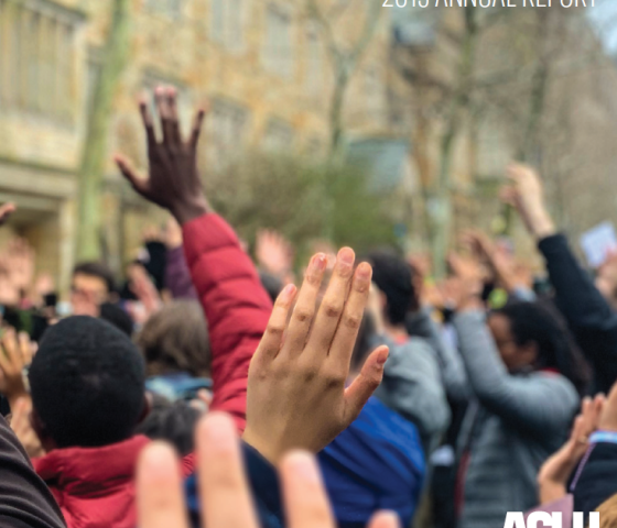 ACLU of Connecticut 2019 Annual Report cover shows, from behind, a crowd of people in "hands up, don't shoot" position. "2019 annual report" appears at the top, with the ACLU of Connecticut logo in white at the bottom